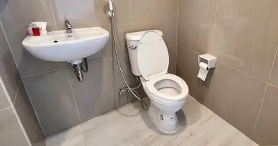 a bathroom with a toilet and a sink at PR ROOM FOR RENT in Kamala Beach