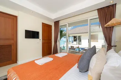 a bedroom with a large bed with a large window at Stunning 5 bedrooms Villa with Panoramic Sea View in Por Bay
