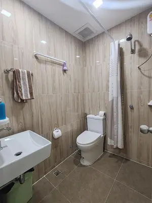a bathroom with a toilet and a sink at My Home in Patong Beach