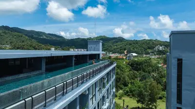 a view from the balcony of a building with a swimming pool at Modern Condo in Boutique Style Resort CGB4 in Phuket Town