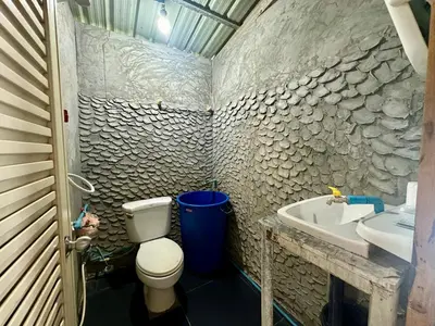 a bathroom with a toilet and a sink at Hilltop view - Phi Phi in Phi Phi Don