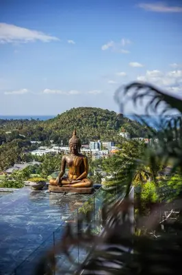 a statue sitting on top of a body of water at Villa ZeniMo in Phuket Town
