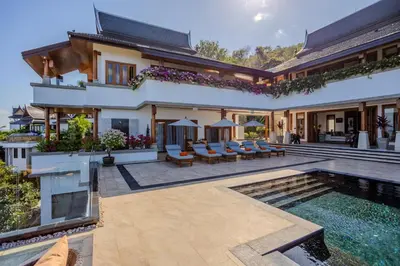 an exterior view of a house with a swimming pool at Villa ZeniMo in Phuket Town
