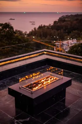 a fire pit on the roof of a building at Villa ZeniMo in Phuket Town