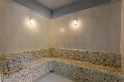 a bathroom with a tub with two lights on the wall at F11 Title 50м2 Люкс Бассейн Рубль ВАТСАП669З582I976 in Nai Yang Beach