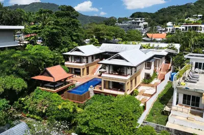 an aerial view of a house with a swimming pool at Seaview 5BR Pool Villa Apsara, Free Breakfast and Full Service, 5 min walk to Kata Beach in Kata Beach