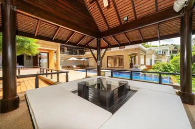 an external view of a villa with a swimming pool at Seaview 5BR Pool Villa Apsara, Free Breakfast and Full Service, 5 min walk to Kata Beach in Kata Beach