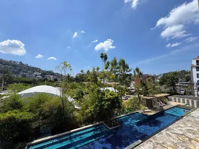 a view of a swimming pool from a building at Aristo 1 Apartments by Beringela in Surin Beach