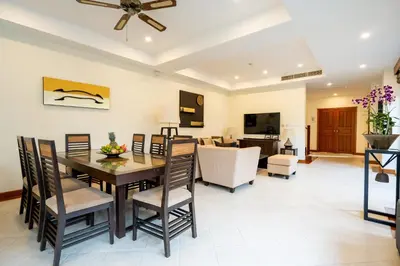 a dining room and living room with a table and chairs at Grand 4-Bed Lagoon Villa - Private Pool & Garden - Laguna in Ban Thalat Choeng Thale