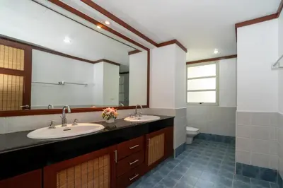a bathroom with two sinks and a large mirror at Scenic Seaview Villa Sea Dream for 9, Tennis Court, 5min walk to Kata Noi Beach in Kata Beach