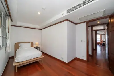 a bedroom with a bed and a wooden floor at Scenic Seaview Villa Sea Dream for 9, Tennis Court, 5min walk to Kata Noi Beach in Kata Beach