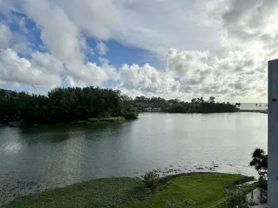 a view of a river with trees and a bridge at 2 bedroom Condo at Cassia Laguna in Bang Tao Beach
