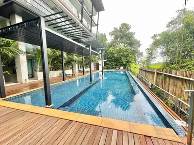 an empty swimming pool on a wooden deck at 1 bedroom near beach - At The Tree in Rawai Beach