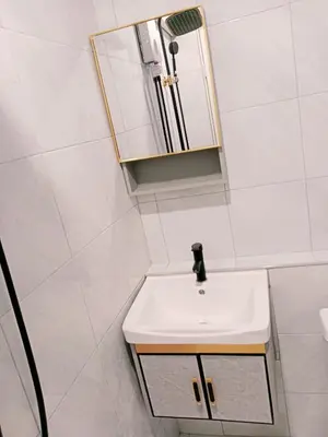 a bathroom with a white sink and a mirror at STP apartment 3rd floor in Patong Beach