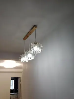 a chandelier hanging from a ceiling in a room at STP apartment 3rd floor in Patong Beach