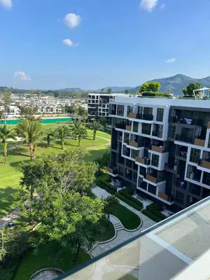 an aerial view of a apartment building with a park at Modern 2-bedroom Apartments with washer in Skypark Laguna Bang Tao in Phuket Town