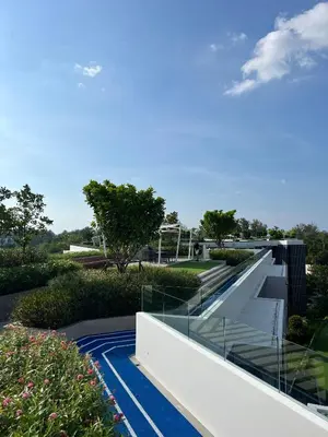 a view of the house from the garden at Modern 2-bedroom Apartments with washer in Skypark Laguna Bang Tao in Phuket Town