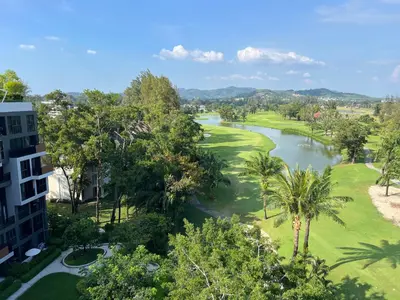 an aerial view of a golf course with a river at Cozy 1-bedroom Apartments in Laguna Skypark Bang Tao in Phuket Town