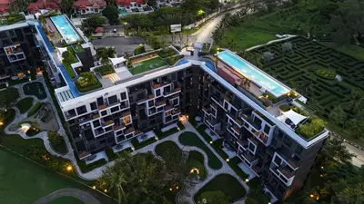 an overhead view of a building with a pool at Cozy 1-bedroom Apartments in Laguna Skypark Bang Tao in Phuket Town