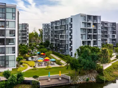 an aerial view of apartment buildings and a park at Cassia 2 BR Sea View apt by NLA in Phuket Town