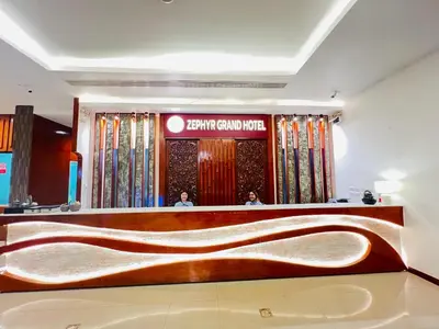 a store front with a large wooden desk in a room at Zephyr Grand Hotel in Patong Beach