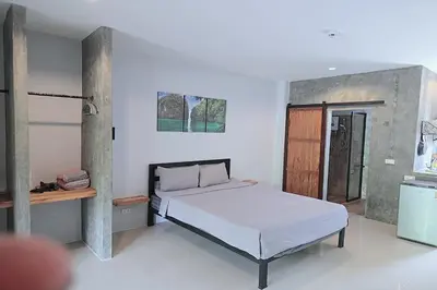 a bedroom with a bed in a room at Aonangstudio in Krabi town