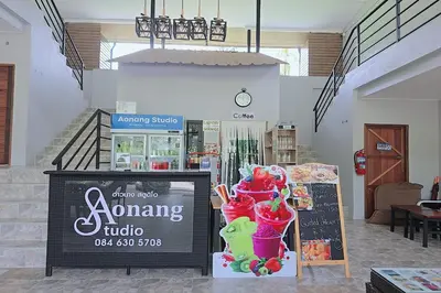 a sign in a store with some ice cream cones at Aonangstudio in Krabi town