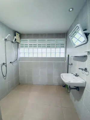 a bathroom with a sink and a shower at Elephant Sports Bar and Accommodation in Phuket Town