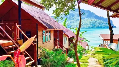 a small house with a view of the water at The Cobble Beach Hotel- Phi Phi Island in Phi Phi Don