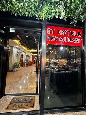 a restaurant with a sign that readsbt hotelres restaurant at BT hotel Kata Beach in Kata Beach