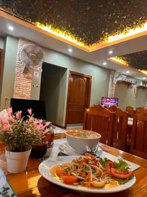 a plate of food on a table with a bowl of food at BT hotel Kata Beach in Kata Beach