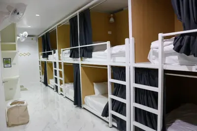 a group of bunk beds in a room at Airhub Hostel Phuket Airport in Nai Yang Beach