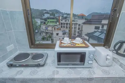 a microwave oven sitting on a counter with a window at The Va Phuket Patong in Patong Beach