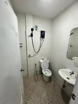 a small bathroom with a toilet and a sink at 84 Bar & Guest House in Ban Huai Luk (1)