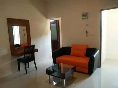 a living room with a couch and a table at Sj House Hotel Aonang in Ban Khlong Haeng