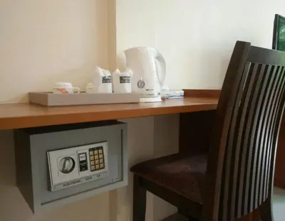 a room with a desk with a chair under a counter at Sj House Hotel Aonang in Ban Khlong Haeng