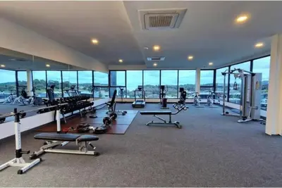 a gym with a lot of treadmills and machines at Calypso rawai seaview apartment 600m walk to beach C4 in Phuket Town