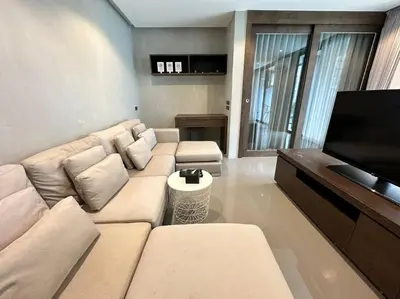 a living room with a couch and a flat screen tv at Kamala Beach P33 Pool view 2 Bedroom Suite in Kamala Beach