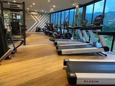 a gym with a row of treadmills at Kamala Beach P33 Pool view 2 Bedroom Suite in Kamala Beach