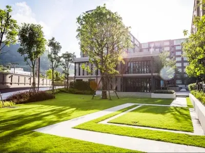 a rendering of a building with a green yard at Vibe Old Town 452 in Phuket Town