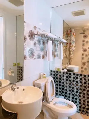 a bathroom with a white toilet and a sink at Patong Terrace Hotel in Patong Beach