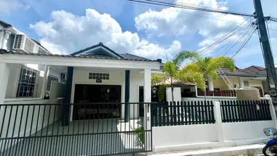 a white house with a fence and palm trees at Bayok 11 - 2 Bedrooms 2 Bathrooms Villa Near Kathu Waterfall in Ban Huai Luk (1)