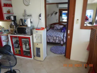 a small room with a kitchen and a bed at Homely with pool near the beach in Kamala Phuket in Kamala Beach