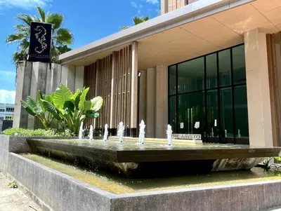 a water fountain in front of a building at The Aristo 1 Condo Surin Beach in Phuket Town