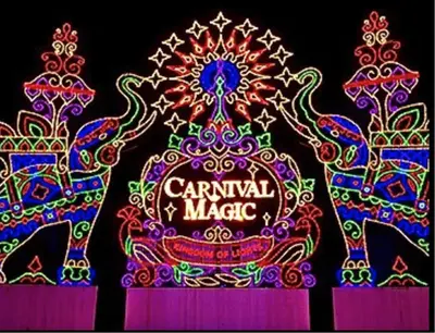 a colorful light display of an elephant with a carnival magic sign at The Aristo 1 Condo Surin Beach in Phuket Town