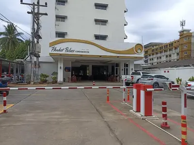a parking lot in front of a building at Phuket Palace apartment with 2 separate rooms in Patong Beach