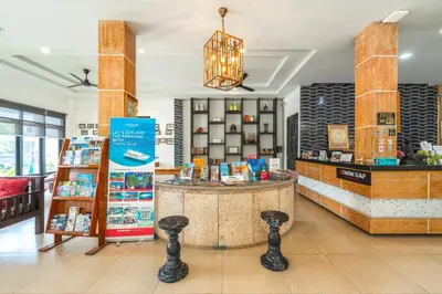 a store with a counter with books on it at Coco Retreat Phuket Resort and Spa - SHA Plus in Chalong