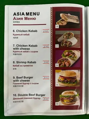 a menu for a restaurant with pictures of food at BT hotel Kata Beach in Kata Beach
