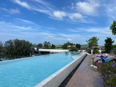 a large swimming pool on the roof of a building at Laguna Skypark in Phuket Town