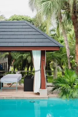 a gazebo next to a swimming pool at Villa Banyak Luxury 4Br villa with nice terrace in Rawai Beach